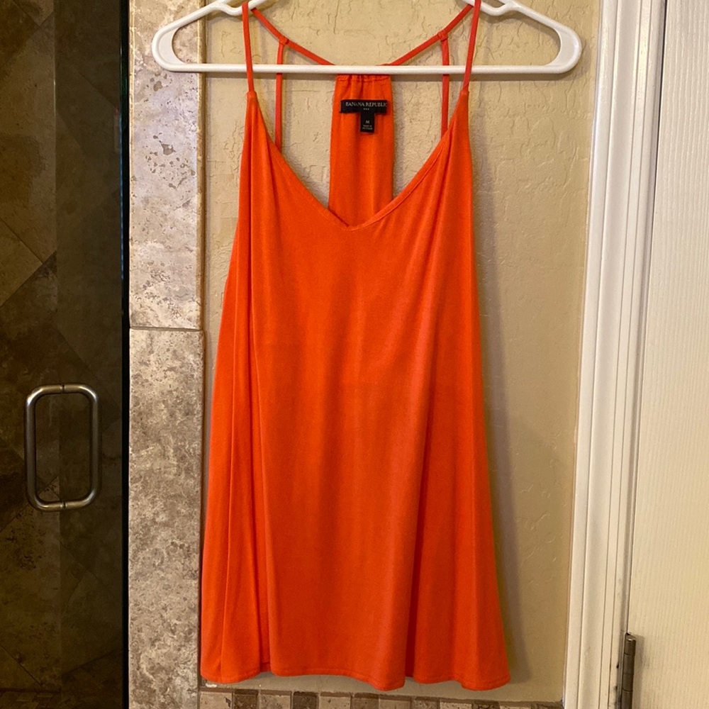 Super cute light orange tank.